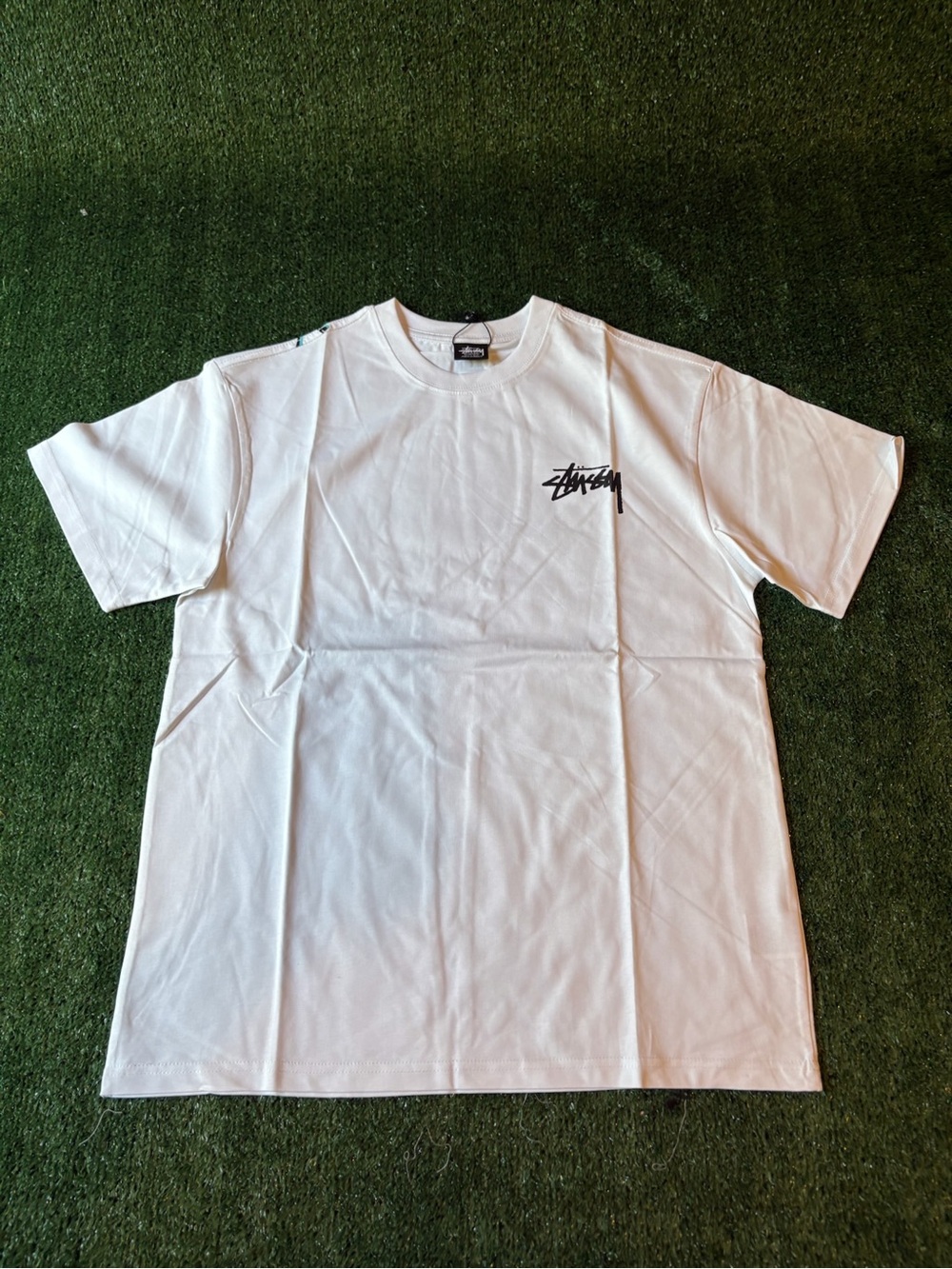 Stussy White Short-Sleeve Tee with Black Chest Script Logo